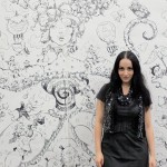 Molly Crabapple with finished piece Molly Crabapple with finished piece