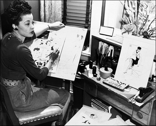 Jackie Ormes at her drawing table.