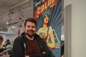 Charles Brownstein Stands in Front of CBLDF Banner. Photo by Jody Culkin