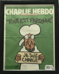 Muhammad holds a sign “Je Suis Charlie”